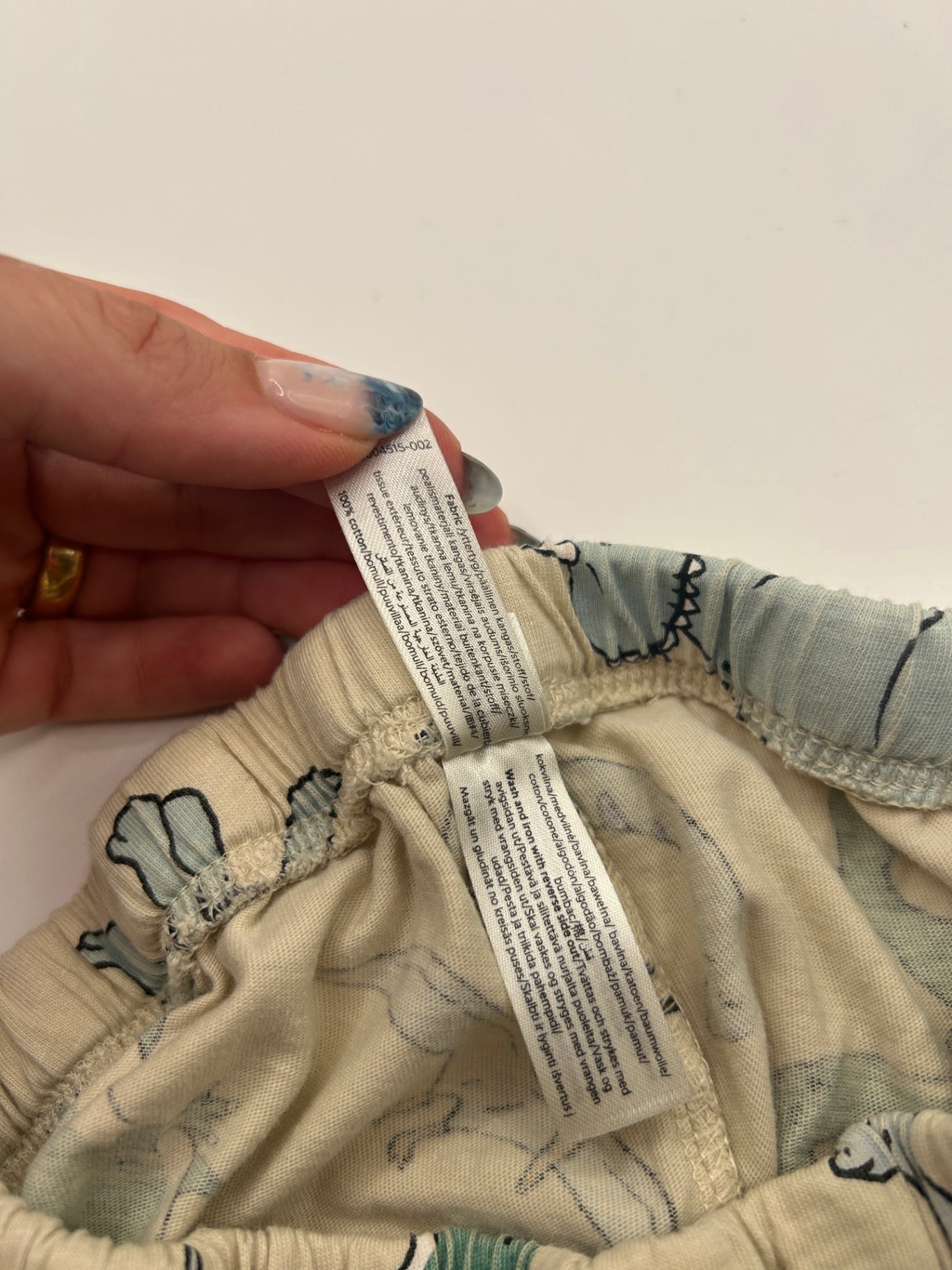 Lindex Pajamas 110 Beige with multicolor dinosaur print
